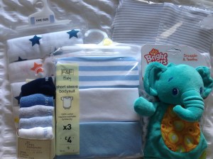 Muslin squares, babygros, socks and a teething toy from Aunty Clare, Mamgu (Welsh nan!) and some family friends