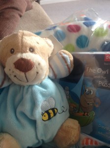 Spotty blanket, nursery rhyme CD and rattly, cuddly bear from work