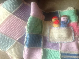 Blanket and cushion knitted by W's Great-Grandma!