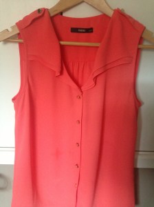 Coral blouse with gold button detail from Oasis