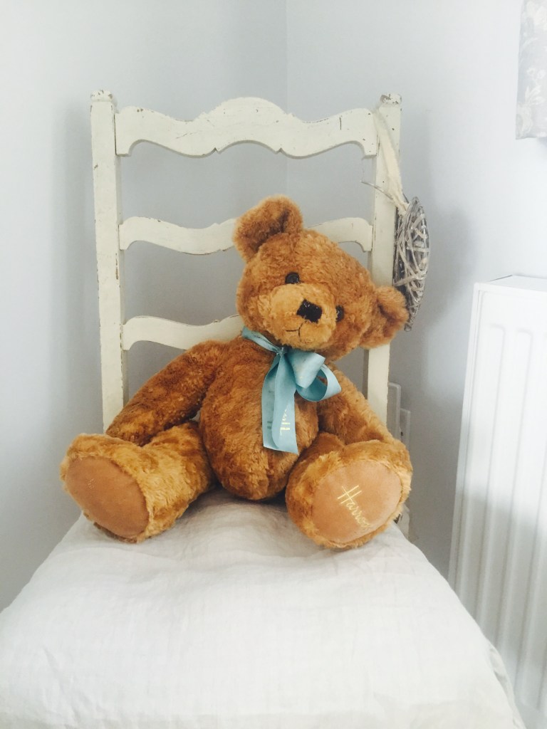 vintage teddy bear on a vintage chair