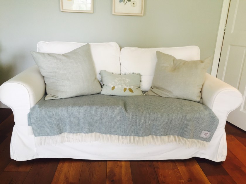 white sofa blue grey cushions