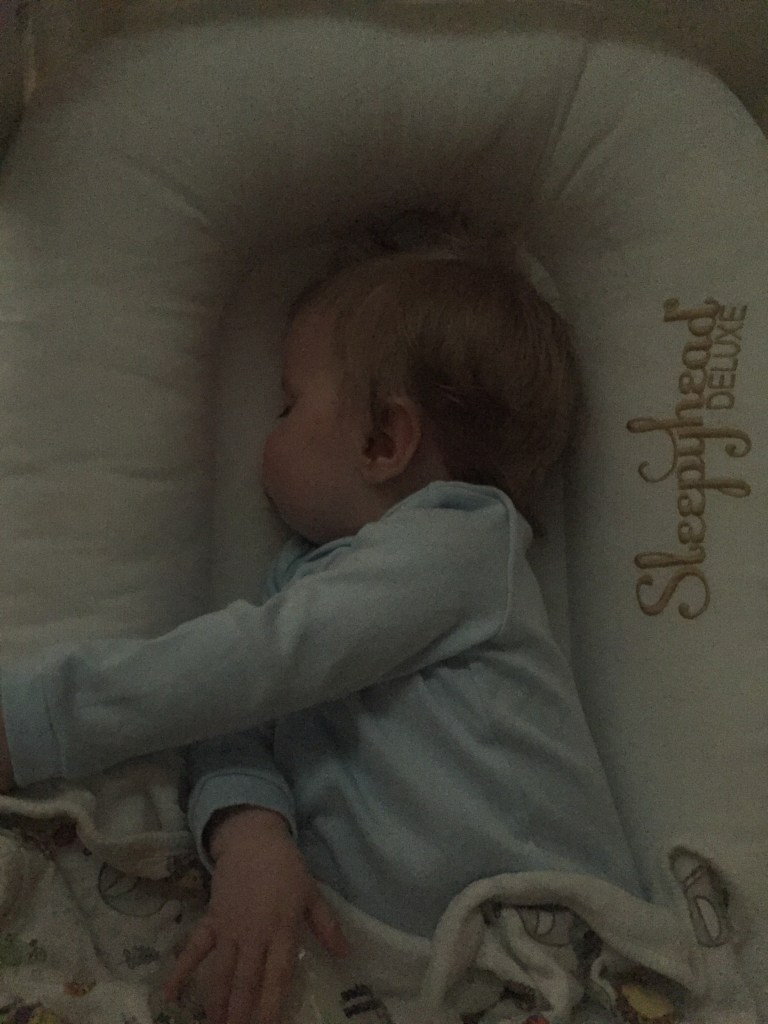 Baby sleeping in Sleepyhead deluxe 